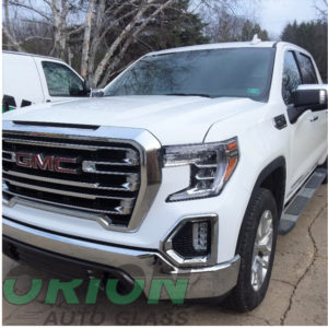 White GMC truck, windshield replacement